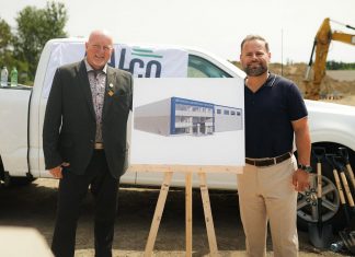Millwright Regional Council director of public affairs and strategic initiatives Chris Sutton and Northumberland-Peterborough South MPP and Minister of Labour, Immigration, Training and Skills Development David Piccini alongside a rendering of the new skilled trades training centre under construction in the Port Hope Business Park during an announcement on August 20, 2026 of $9.8 million in provincial funding for the facility led by UBC Millwright Local 2309. (Photo: Office of David Piccini)