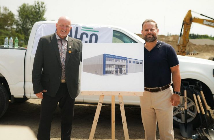 Millwright Regional Council director of public affairs and strategic initiatives Chris Sutton and Northumberland-Peterborough South MPP and Minister of Labour, Immigration, Training and Skills Development David Piccini alongside a rendering of the new skilled trades training centre under construction in the Port Hope Business Park during an announcement on August 20, 2026 of $9.8 million in provincial funding for the facility led by UBC Millwright Local 2309. (Photo: Office of David Piccini)