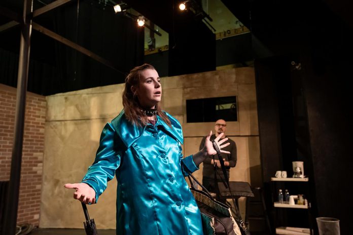 Carissa Kaye, with John Austin in the background, during a rehearsal for the Peterborough Theatre Guild's season-opening production of the psychological drama "Venus in Fur" by American playwright David Ives. Directed by Lisa Dixon, the play runs for 10 performances from September 18 to October 3, 2026. (Photo: Jordan Lyall Photography)