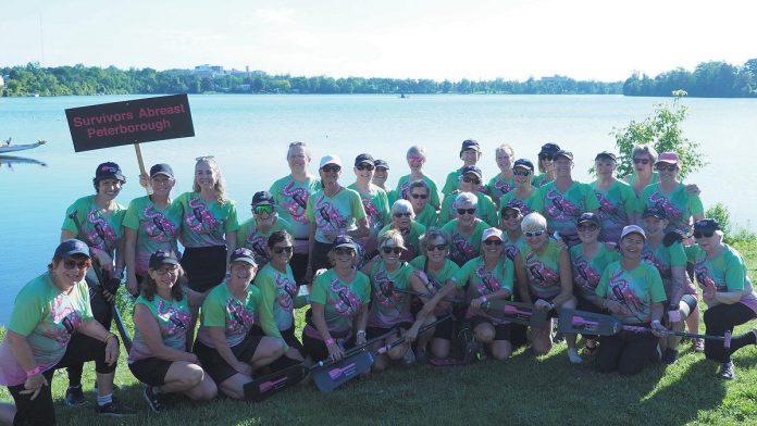 Twenty-two members of Peterborough's Survivors Abreast dragon boat team and their coach will travel to the French Alps to participate in the International Breast Cancer Paddlers' Commission Participatory Dragon Boat Festival in Aix-les-Bains, with the parade of nations and opening ceremonies taking place on August 27, 2026 followed by two days of racing on Lac du Bourget. The races will be livestreamed. (Photo courtesy of Survivors Abreast)