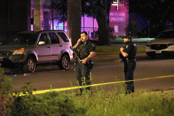 Police officers outside the Sons of Jacob Synagogue in Belleville on September 20, 2026, when an exchange of gunfire near the synagogue where worshippers had gathered for Yom Kippur sent a 29-year-old man man and a police officer to hospital. (Photo: CBC)