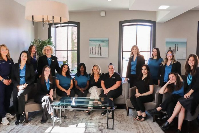Euphoria Wellness Spa owner Simone Dobson (centre) and some members of her team celebrate the downtown Peterborough spa's 19th anniversary in 2025 during its annual Beauty Night: Spa & Sip event. (Photo: Euphoria Wellness Spa)