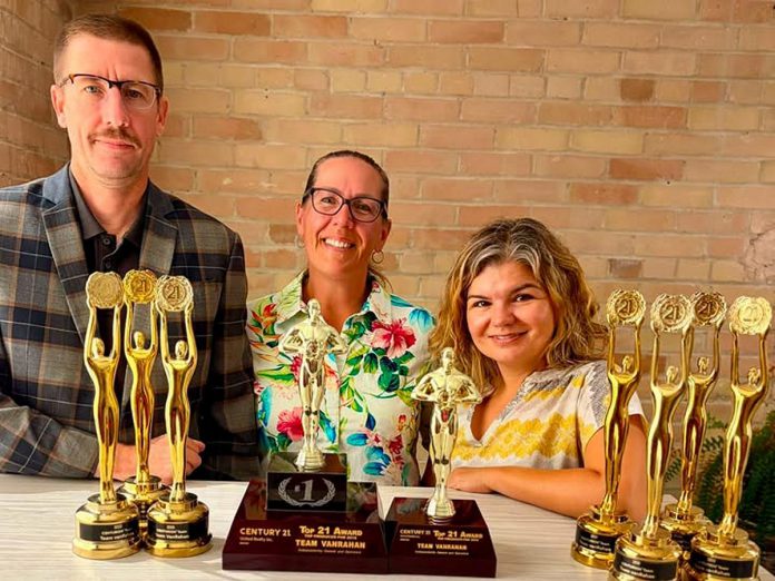 Ben vanVeen, Laurie Heigh, and Catherine Hanrahan of Team vanRahan Century 21 United Realty Peterborough, pictured with a few of their awards. Not pictured are director of operations Sara Lytle and Bruce Shaw, who joined Team vanRahan last year as a buyer agent. (Photo: Team vanRahan)