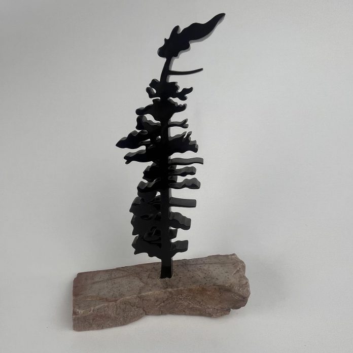 Peterborough artist Nick Leniuk has donated a sculpture titled "Sunday Morning" to the Lakeside Gala auction on October 3, 2026 at The Canadian Canoe Museum. Celebrating the Canadian landscape, the piece is crafted from black Wonderstone and mounted on a natural rose quartz base to interpret a windswept evergreen. (Photo courtesy of The Canadian Canoe Museum)