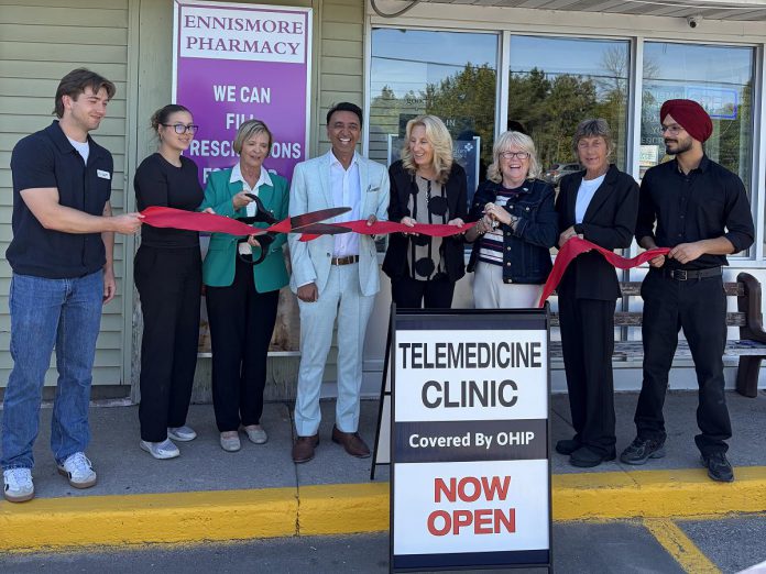 With Ennismore Pharmacy owner and pharmacist Mehul Pathak standing to her left, Selwyn Township mayor Sherry Senis cuts the ribbon to officially open the pharmacy's new telemedicine clinic. The clinic offers OHIP-covered virtual consultations with licensed healthcare professionals for assessments, treatment, prescription services, referrals, and follow-up care. (Photo courtesy of Ennismore Pharmacy)