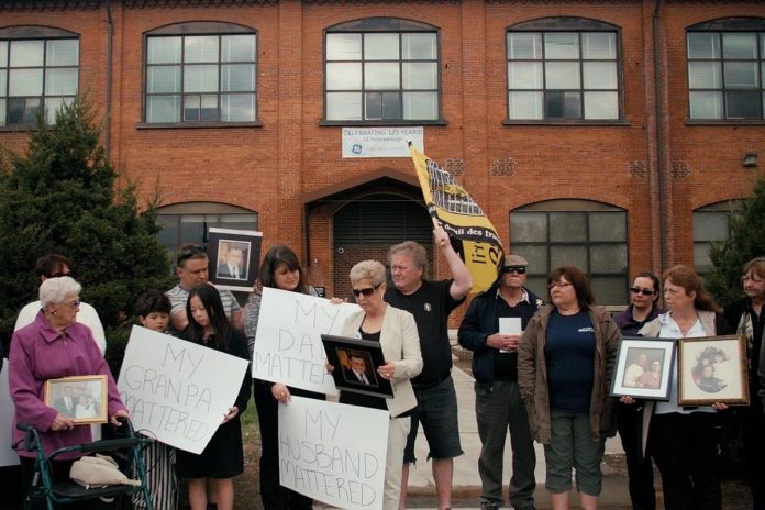 A scene from the 2019 documentary "Town of Widows" by Natasha Luckhardt and Rob Viscardis, which documents the fight for justice by former GE workers and their widows in Peterborough who believe workplace exposure to toxic substances caused illnesses and cancer deaths. The documentary will be screened during "Good Neighbours Deserve Answers," a free community forum at the Peterborough Public Library on October 18, 2026 that seeks answers from GE Vernova and Ontario's Ministry of the Environment, Conservation and Parks about the plan to demolish most of the contiminated buildings at the factory complex in downtown Peterborough. (Photo: Rob Viscardis)