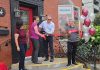 New owners Theresa Thibadeau and Mark Walsh cut the ribbon at the entrance to Grady's Feet Essentials at 231 King Street in downtown Peterborough as retiring owners Kelli and Tony Grady look on during a ceremony on September 1, 2026. (Photo courtesy of Grady's Feet Essentials)