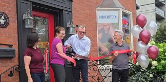 New owners Theresa Thibadeau and Mark Walsh cut the ribbon at the entrance to Grady's Feet Essentials at 231 King Street in downtown Peterborough as retiring owners Kelli and Tony Grady look on during a ceremony on September 1, 2026. (Photo courtesy of Grady's Feet Essentials)