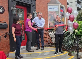 New owners Theresa Thibadeau and Mark Walsh cut the ribbon at the entrance to Grady's Feet Essentials at 231 King Street in downtown Peterborough as retiring owners Kelli and Tony Grady look on during a ceremony on September 1, 2026. (Photo courtesy of Grady's Feet Essentials)