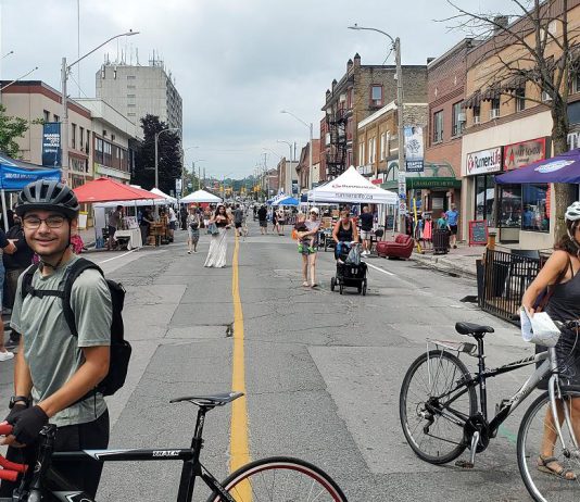 Downtown Peterborough's Second Saturday Sidewalk Sale on August 8, 2026 allowed people to experience Charlotte Street free of car traffic. Many Canadian cities are starting to reimagine their streets as places for pedestrians, not just cars. (Photo: Brett Throop / GreenUP)