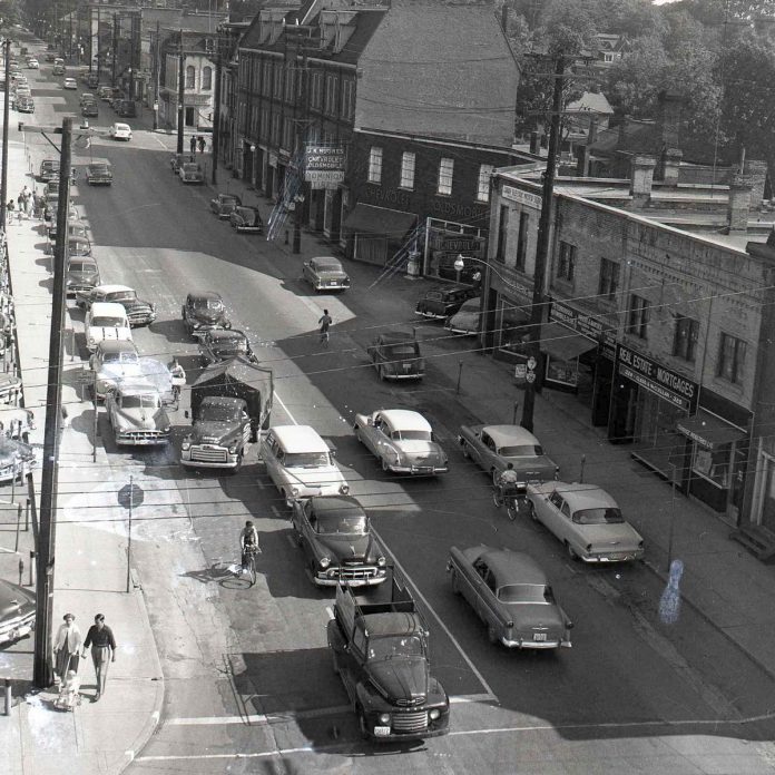 Traffic flowed in both directions in downtown Peterborough along Water Street, looking north from Charlotte Street, in this 1956 photo. Water and George streets were converted to one-way traffic the following year in a bid to speed up traffic in response to congestion. Today, some Canadian cities are going back to two-way streets in their downtowns to slow vehicles down and improve pedestrian safety. (Photo courtesy of Trent Valley Archives)