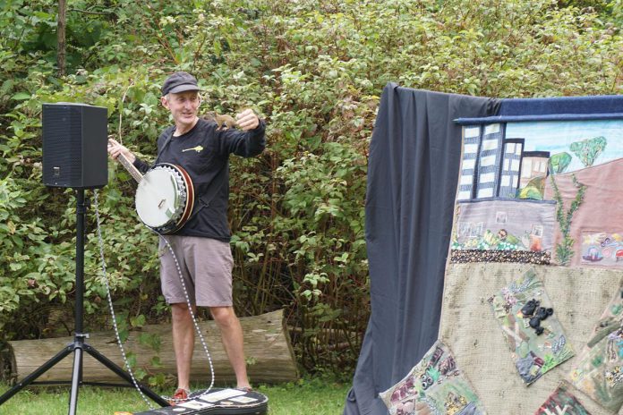 A baby red squirrel unexpectedly joined Glen Caradus' "Call of the Garden" puppet show at GreenUP Ecology Park's Family Night on August 27, 2026. (Photo: Alex Karn / GreenUP)