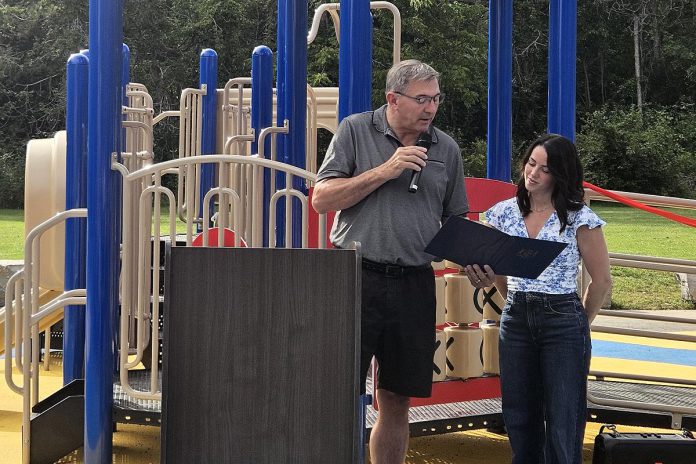 Peterborough-Kawartha MPP Dave Smith with Julie Grant at Ennismore Waterfront Park on September 4, 2026 during the grand opening of Jude's Joy, the first barrier-free playground in Selwyn Township. In addition to the $200,000 in community donations raised during the campaign in partnership with the Ennismore Optimist Club and Selwyn Township, the provincial government provided a $145,300 capital grant through the Ontario Trillium Foundation. (Photo courtesy of Selwyn Township)