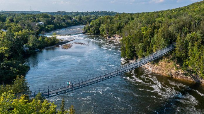Open daily year-round, the Ranney Gorge Suspension Bridge in Campbellford is a 300-foot-long bridge hovering 30 feet over the Trent River. The suspension bridge is located in Ferris Provincial Park, which has over 10 kilometres of hiking trails through forests and riverside settings with views of Ranney Falls. (Photo: Northumberland Tourism)