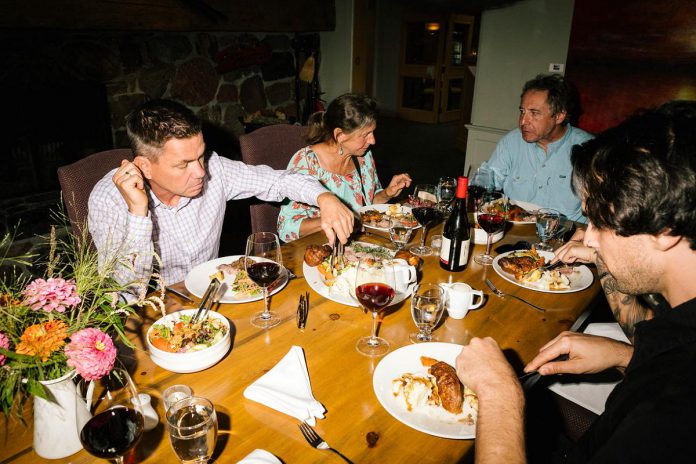 Greg Elmhirst (left), general manager and fourth-generation family owner of Elmhirst's Resort in Keene, has a deep passion for wine and has been hosting VQA wine tastings for guests for more than 20 years. In 2025, Elmhirst's Resort launched the North Shore Wine Society to introduce members to hard-to-find wines from around the world. The free membership includes subscription to a quarterly e-newsletter with food features from the resort's chefs and wine education from sommelier Christopher Wilton, as well as first access to unique dining events. (Photo courtesy of Elmhirst's Resort)