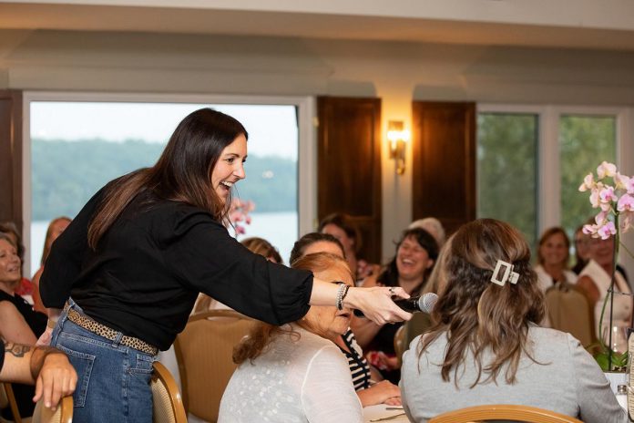 As a lifelong storyteller, Megan Murphy says there's an art to emceeing, including harnessing the energy that allows a roomful of strangers to feel like they're part of something more. She has emceed for conferences, panels, galas, and fundraisers, and works alongside the event organizer to capture the "heartbeat" of the event. (Photo: Jordan Lyall Photography)