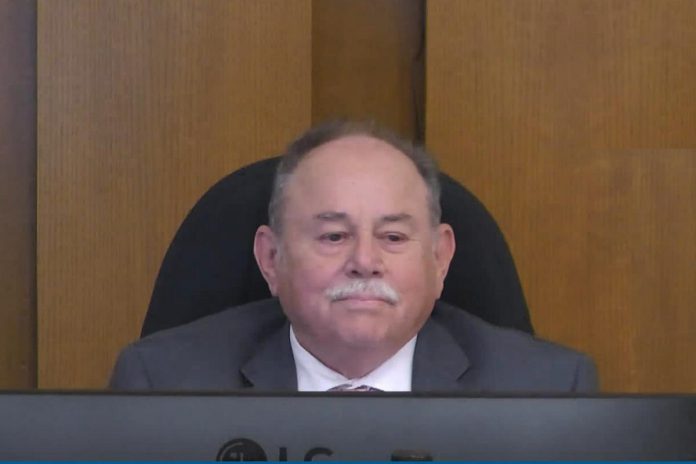 Councillor Keith Riel reacts at the general committee meeting on September 21, 2026 after he was rebuked by councillor general committee chair Andrew Beamer for electioneering during the debate on Ernst & Young's Effectiveness and Efficiency Review. (kawarthaNOW screenshot of City of Peterborough video)