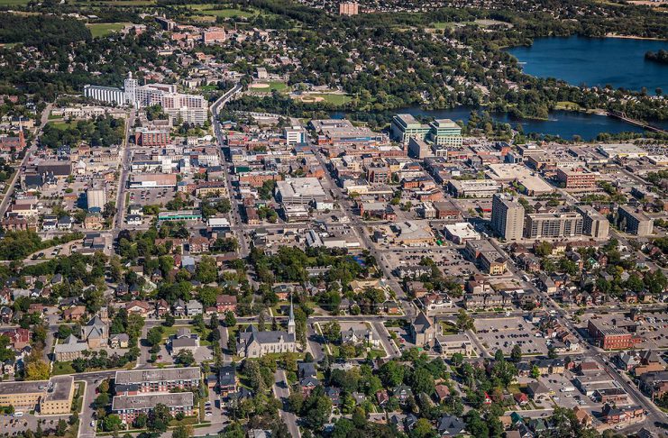 An aerial view of a portion of downtown Peterborough in 2012, looking east across the Hunter Street bridge to East City. Since this photo was taken, several multi-storey residential developments have been built in East City where, in 2025, city council also approved the construction of a new 17-storey high-rise. (Photo: City of Peterborough)
