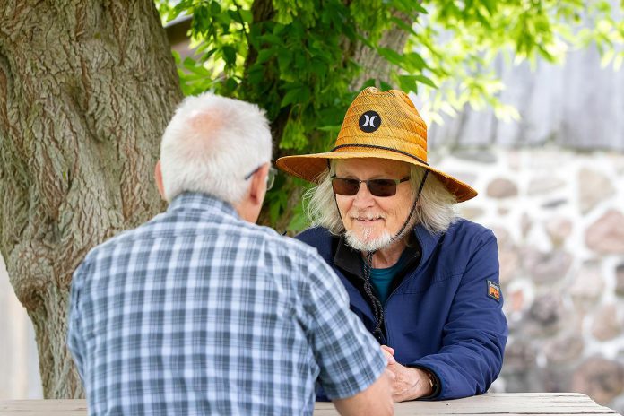 4th Line Theatre founder Robert Winslow (right) speaks with kawarthaNOW's Paul Rellinger during a media day event for Leanna Brodie's play "Schoolhouse" on June 17, 2026 hosted by 4th Line Theatre at Winslow Farm near Millbrook. (Photo: Jordan Lyall / kawarthaNOW)