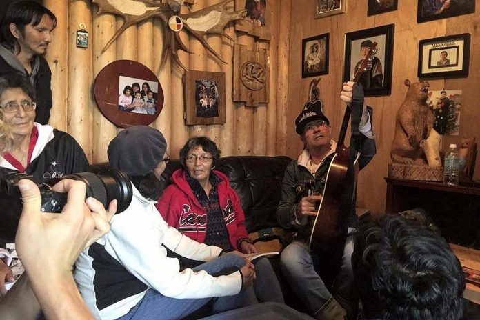In September 2016, the year before he died from brain cancer, Gord Downie (right) met with Chanie Wenjack's sister Pearl Wenjack (centre) in Marten Falls First Nation. (Photo: Sheila North Wilson / Manitoba Keewatinowi Oktmakanak)