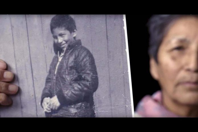 Pearl Wenjack holds a photo of her brother Chanie Wenjack, a 12-year-old Anishinaabe boy who died from exposure in October 1966 while trying to make his way home after escaping from the Cecilia Jeffrey Indian Residential School near Kenora. (Photo: Historica Canada)