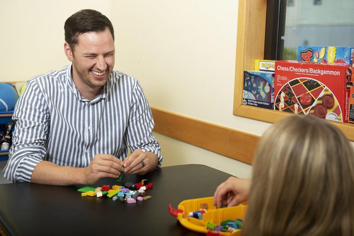 Evan Coghlan, registered psychotherapist and clinical director of Lift Lock Therapy, during a play-based therapy session. The practice has moved to 260 Milroy Drive in Peterborough. (Photo courtesy of Lift Lock Therapy)
