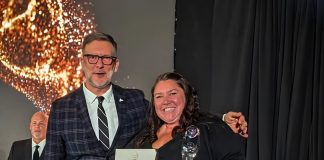 The Canadian Canoe Museum in Peterborough named Ontario’s Attraction of the Year Tourism Industry Association of Ontario president and CEO Andrew Siegwart presents the organization's Attraction of the Year award to The Canadian Canoe Museum's marketing and communications manager Jaimie Eastabrook during the Ontario Tourism Awards of Excellence Gala on October 22, 2026. (Photo courtesy of The Canadian Canoe Museum)