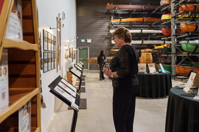 Guests browse items in the Collection Hall at The Canadian Canoe Museum in Peterborough during the second annual Lakeside Gala on October 3, 2026, a fundraiser to support the museum's core programming and the care of its nationally significant collection of paddled watercraft. (Photo courtesy of The Canadian Canoe Museum)