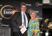 David Feeley of Cogeco YourTV receiving the 2026 Business Citizen of the Year award from Susan Dunkley, board chair of the Peterborough and the Kawarthas Chamber of Commerce, at the annual Business Excellence Awards gala at Kawartha Downs in Fraserville on October 22, 2026. (Photo: Jordan Lyall / Peterborough and the Kawarthas Chamber of Commerce)
