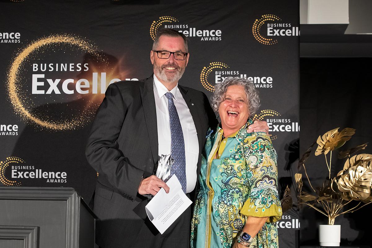 David Feeley of Cogeco YourTV receiving the 2026 Business Citizen of the Year award from Susan Dunkley, board chair of the Peterborough and the Kawarthas Chamber of Commerce, at the annual Business Excellence Awards gala at Kawartha Downs in Fraserville on October 22, 2026. (Photo: Jordan Lyall / Peterborough and the Kawarthas Chamber of Commerce)