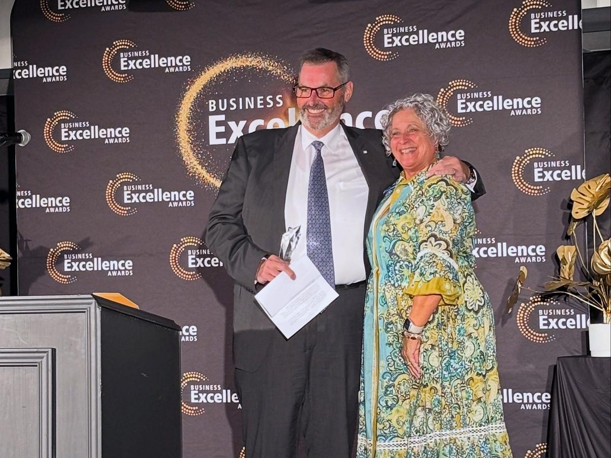 David Feeley of Cogeco YourTV receiving the 2026 Business Citizen of the Year award from Susan Dunkley, board chair of the Peterborough and the Kawarthas Chamber of Commerce, at the annual annual Business Excellence Awards gala at Kawartha Downs in Fraserville on October 22, 2026. (Photo: Peterborough and the Kawarthas Chamber of Commerce)