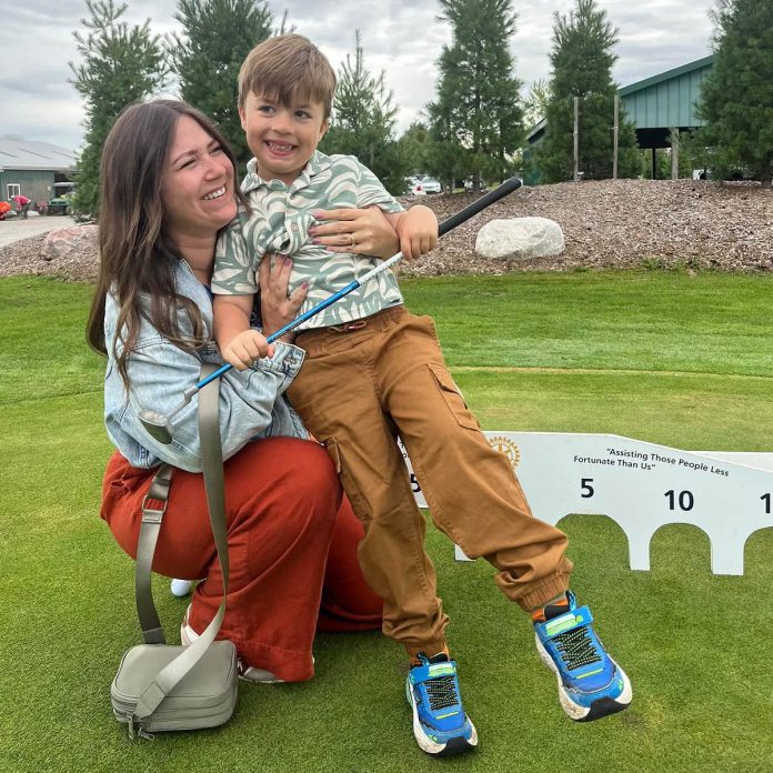 Hannah Bailey hugs her son Max at the recent Fore the Kids golf tournament, organized by the Rotary Club of Peterborough. Prior to the start of the golf tournament, Hannah spoke about her family's journey of inclusion, after Max was diagnosed with a rare genetic condition, and how Five Counties Children's Centre helped support his speech skills. (Photo courtesy of Five Counties Children's Centre)