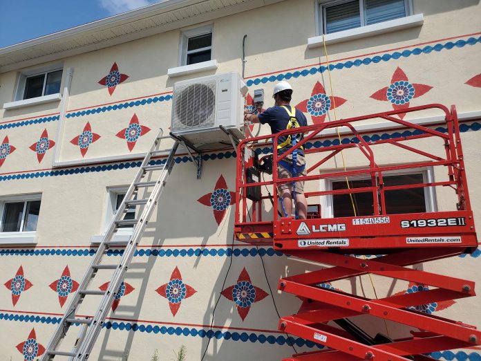 Heat pumps are also gaining popularity in commercial buildings. This installation is taking place at the Peterborough Wellness Group location on Charlotte Street in Peterborough. (Photo courtesy of 123 HVAC)