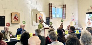 At an all candidates meeting for the Municipality of Highlands East hosted by the Haliburton Highlands Healthy Democracy Project in Cardiff on September 12, 2026 in advance of the October 26 municipal election, moderator Heather Reid (at podium) led the "rapid-fire" portion of the event with Highlands East mayoral candidates (left to right) Dave Burton, Mike Killingsworth, Cheryl Ellis (hidden by podium), Steve Kauffeldt, and Krystle Anne Pegg. (Photo: Haliburton Highlands Healthy Democracy Project)