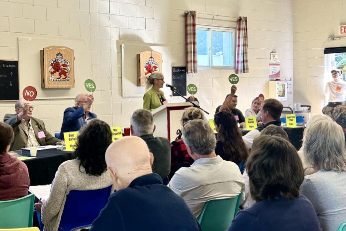 At an all candidates meeting for the Municipality of Highlands East hosted by the Haliburton Highlands Healthy Democracy Project in Cardiff on September 12, 2026 in advance of the October 26 municipal election, moderator Heather Reid (at podium) led the "rapid-fire" portion of the event with Highlands East mayoral candidates (left to right) Dave Burton, Mike Killingsworth, Cheryl Ellis (hidden by podium), Steve Kauffeldt, and Krystle Anne Pegg. (Photo: Haliburton Highlands Healthy Democracy Project) At an all candidates meeting for the Municipality of Highlands East hosted by the Haliburton Highlands Healthy Democracy Project in Cardiff on September 12, 2026 in advance of the October 26 municipal election, moderator Heather Reid (at podium) led the "rapid-fire" portion of the event with Highlands East mayoral candidates (left to right) Dave Burton, Mike Killingsworth, Cheryl Ellis (hidden by podium), Steve Kauffeldt, and Krystle Anne Pegg. (Photo: Haliburton Highlands Healthy Democracy Project)