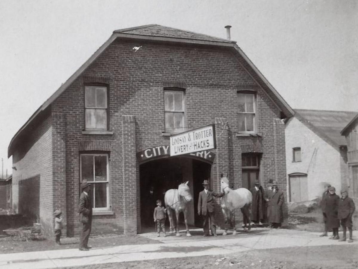 The building at 19 Cambridge Street South in downtown Lindsay, pictured circa 1860 to 1887 when it was Lindsay & Trotter Livery & Hacks, owned by Bob Lindsay, Charles Lindsay, and Hunter Trotter. (Photo courtesy of Kawartha Art Gallery)