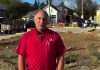 Kawartha Home Hardware general manager Garnet Hinds at the site of the former historic Kawartha Home Hardware building at 24 Queen Street in downtown Lakefield, which was demolished after being severely damaged in a fire on October 9, 2025. In a video posted on social media on October 8, 2026, Hinds says construction on a new building is ready to proceed. (kawarthaNOW screenshot)