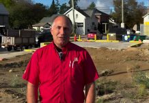 Kawartha Home Hardware general manager Garnet Hinds at the site of the former historic Kawartha Home Hardware building at 24 Queen Street in downtown Lakefield, which was demolished after being severely damaged in a fire on October 9, 2025. In a video posted on social media on October 8, 2026, Hinds says construction on a new building is ready to proceed. (kawarthaNOW screenshot)