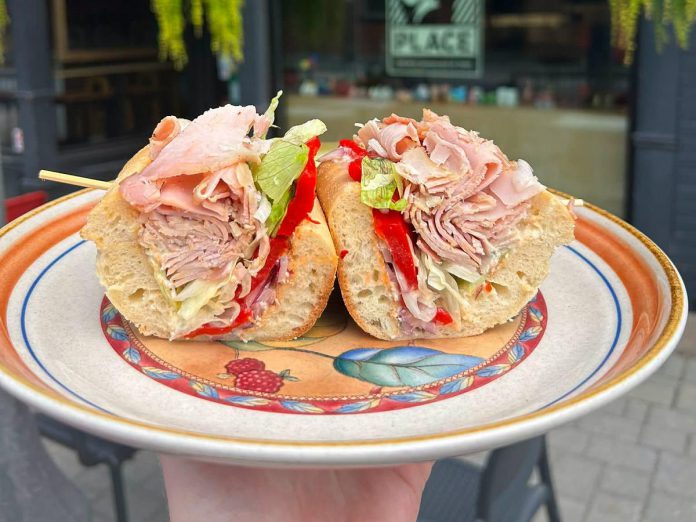 Every week, Sam's Place in downtown Peterborough offers a new sandwich special with a creative and welcoming name. For 16 years, this deli has been known to serve "The Best Samwiches in Town" using locally sourced bread, cheese, and meat that's cured and smoked in-house. (Photo courtesy of Sam's Place)