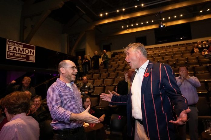 New Stages Theatre Company artistic director Mark Wallace and mayor-elect Michael Eamon celebrate his victory at Market Hall Performing Arts Centre in downtown Peterborough on October 26, 2026. (Photo: Jordan Lyall / kawarthaNOW)