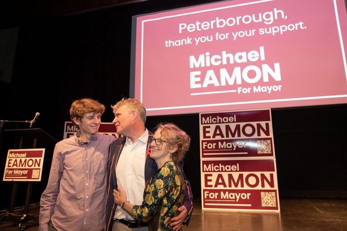 Mayor-elect Michael Eamon celebrates his victory with son Will and wife Jennine at Market Hall Performing Arts Centre in downtown Peterborough on October 26, 2026. (Photo: Jordan Lyall / kawarthaNOW)