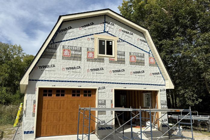 The garage packages offered by Merrett Home Hardware Building Centre's Beaver Homes & Cottages program include framing, siding, windows, and overhead and entry doors. All supplied materials and lumber conform to or exceed the National Building Code of Canada and all provincial codes. (Photo courtesy of Merrett Home Hardware Building Centre)