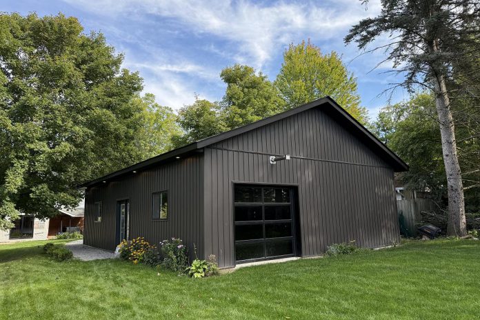 Most of the garage packages offered by Merrett Home Hardware Building Centre's Beaver Homes & Cottages program include a shingle roof and vinyl siding. For durability and ease of installation, many clients decide to customize their package with a steel roof from Merrett's main supplier, Havelock Metals, as well as steel siding or engineered wood siding like LP SmartSide. (Photo courtesy of Merrett Home Hardware Building Centre)