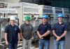 Jeff Menzies and Bill Harris of Kawartha Ethanol with Michael Skinner and Jamie Mason of Miranda Water Technologies at Kawartha Ethanol's Havelock facility during an industrial wastewater treatment pilot using Miranda's MC200 Miracell Rotating Biological Contactor (RBC) system, which removed more than 98 per cent of targeted contaminants under tested operating conditions. (Photo courtesy of Miranda Water Technologies)