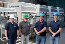 Jeff Menzies and Bill Harris of Kawartha Ethanol with Michael Skinner and Jamie Mason of Miranda Water Technologies at Kawartha Ethanol's Havelock facility during an industrial wastewater treatment pilot using Miranda's MC200 Miracell Rotating Biological Contactor (RBC) system, which removed more than 98 per cent of targeted contaminants under tested operating conditions. (Photo courtesy of Miranda Water Technologies)