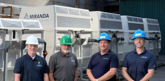 Jeff Menzies and Bill Harris of Kawartha Ethanol with Michael Skinner and Jamie Mason of Miranda Water Technologies at Kawartha Ethanol's Havelock facility during an industrial wastewater treatment pilot using Miranda's MC200 Miracell Rotating Biological Contactor (RBC) system, which removed more than 98 per cent of targeted contaminants under tested operating conditions. (Photo courtesy of Miranda Water Technologies)