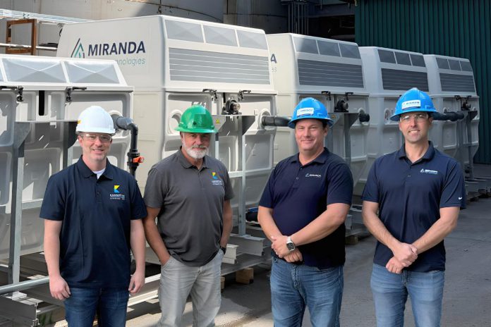 Jeff Menzies and Bill Harris of Kawartha Ethanol with Michael Skinner and Jamie Mason of Miranda Water Technologies at Kawartha Ethanol's Havelock facility during an industrial wastewater treatment pilot using Miranda's MC200 Miracell Rotating Biological Contactor (RBC) system, which removed more than 98 per cent of targeted contaminants under tested operating conditions. (Photo courtesy of Miranda Water Technologies)