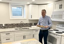 One City Peterborough's director of property development Michael Vanderherberg in the kitchen of a self-contained basement apartment, which is part of a partnership with Peterborough Action for Tiny Homes (PATH) to construct additional rental units that provide supportive housing options for tenants of residential properties owned by One City Peterborough. (Photo courtesy of One City Peterborough)