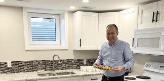 One City Peterborough's director of property development Michael Vanderherberg in the kitchen of a self-contained basement apartment, which is part of a partnership with Peterborough Action for Tiny Homes (PATH) to construct additional rental units that provide supportive housing options for tenants of residential properties owned by One City Peterborough. (Photo courtesy of One City Peterborough)
