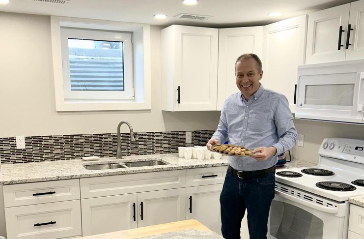 Beyond emergency shelter: One City Peterborough and its partners are creating stable affordable housing in backyards and basements One City Peterborough's director of property development Michael VanDerHerberg in the kitchen of a self-contained basement apartment, which is part of a partnership with Peterborough Action for Tiny Homes (PATH) to construct additional rental units that provide supportive housing options for tenants of residential properties owned by One City Peterborough. (Photo courtesy of One City Peterborough)